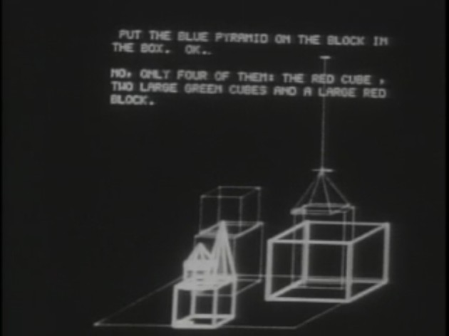 A still from the original SHRDLU demonstration on the DEC-340 display: white wireframe cubes, a pyramid and an open box with a gripper arm above a stack, and the teletype exchange 'PUT THE BLUE PYRAMID ON THE BLOCK IN THE BOX. OK.' answered by 'NO, ONLY FOUR OF THEM: THE RED CUBE, TWO LARGE GREEN CUBES AND A LARGE RED BLOCK.'